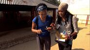 Kisha & Jen reading the Detour clue for the seventh leg.