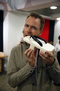 Phil takes a bite out of a sandal.