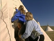 810-GodlewskiFamily-Detour.png (1.3 MB) The Godlweskis struggle to pitch a teepee at the Native Tradition Detour on the second half of Leg 10.