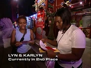 Lyn & Karlyn reading the Roadblock clue on Leg 1.