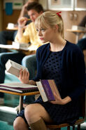 Gwen sits at her desk at Midtown High.