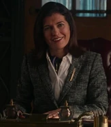 Helen Stern as British Desk Attendant