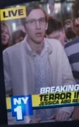 Brian McElhaney as Times Square Bystander