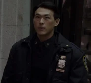 James Chen as Police Officer
