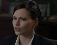 Jill Flint as Receptionist