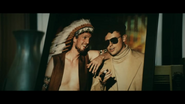 The Legend and the Big Chief Apache posing in a photograph, seen at The Legend's house in episode 3x05