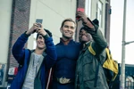 Homelander taking a selfie with some fans.
