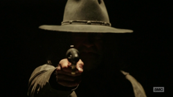 The Saint points his gun toward Jesse.png