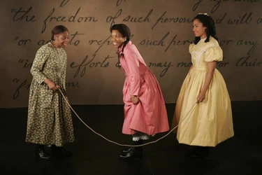 A promotional image for Addy: An American Girl Story, with Felicia Vonshell Loud as Sarah, Myxolydia Tyler as Addy, and Tanesha Ross as Harriet.