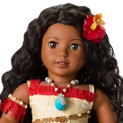 Close up of face, necklace, and flower hair clip.