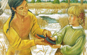 The Youngest Warrior shows Kirsten that his moccasins are warm.