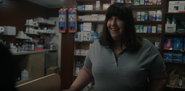 Susan under the guise of a pharmacist
