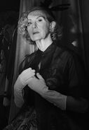 Frances Conroy as Gloria Mott