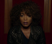 Angela Bassett as Monet Tumusiime