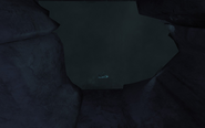 A sneak peak through a hole in the crumbling walls at the detonator handle, lying conspicuously in plain view.