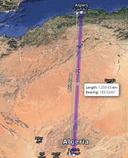 The probable flightpath of the Cassandra's first leg, running from Algiers on the Mediterranean sea, in the north, almost directly south to In Salah, partway through the Sahara Desert. The point-to-point distance is shown as 1,060 kilometers, and the bearing is 3 degrees west of south (or S 3° W).