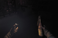 Henri holding a lighter and petrol bomb.