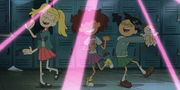 Marcy dancing in a school hallway with her childhood friends.