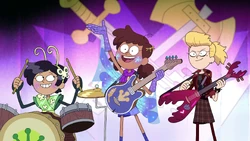 Marcy looking at her bandmates and not the audience.
