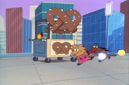 Norbert and Daggett running past a pretzel stand…