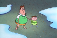 A dad and his son near the tree