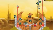 The strategy for completion of the level. The pig must shoot at a right angle, for the laser to set off TNT boxes, reflect and cut the thin metal beams at the top.