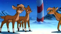 Arrow catching Rudolph and Zoey under the mistletoe