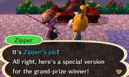 A player receiving a picture of Zipper after handing in a Grand Prize ticket.