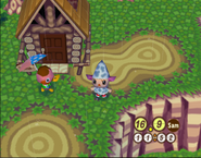 Caro devant sa maison dans Animal Crossing