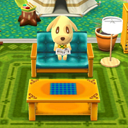 Goldie reading a book at the campsite. (This was also her original loading screen photo)