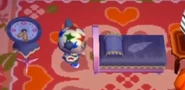 Le lit et l'horloge Dindon chez un joueur dans Animal Crossing
