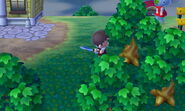 A Player chopping a tree down with an axe in New Leaf