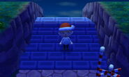 A player standing on the stairs to Main Street.