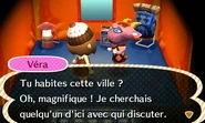 Véra campant dans le village du joueur