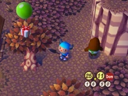 Regalo volador en un árbol.