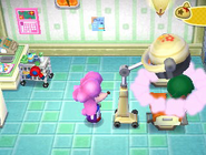 Harriet operating the hairstyle machine in New Leaf