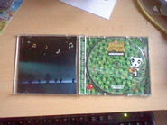 Inside the case, revealing the CD and booklet