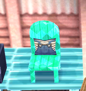 The green chair in New Leaf (Emerald Wood / Clothing Cushion)