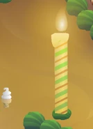 The candles that line the cake and the ice cream cone carried after clicking on the flame.