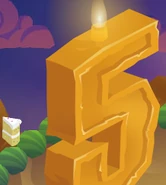 The top candle for the party in 2015 and the slice of cake carried after clicking on the flame.