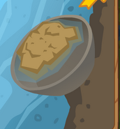 The dirt in the Silver Panning minigame before the silver is uncovered.