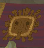 Zios' face on a rug, seen at the second floor of the Chamber of Knowledge.