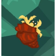 A yellow hermit crab with a reddish brown shell