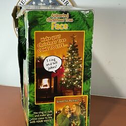 Singing christmas shop tree with face