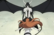 Ulquiorra prevents Orihime from healing Ichigo, stating it as useless.