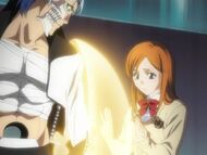 Orihime healing Grimmjow's lost arm.