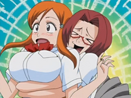Chizuru grabs Orihime from behind in a slightly possessive manner.