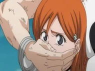 Orihime is held hostage by Nnoitra Gilga.