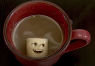 Marshmallow laughing on a hot cocoa/hot chocolate drink