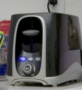 Toaster as an inanimate object in Wazzup Blowup. A mustachio is underneath.